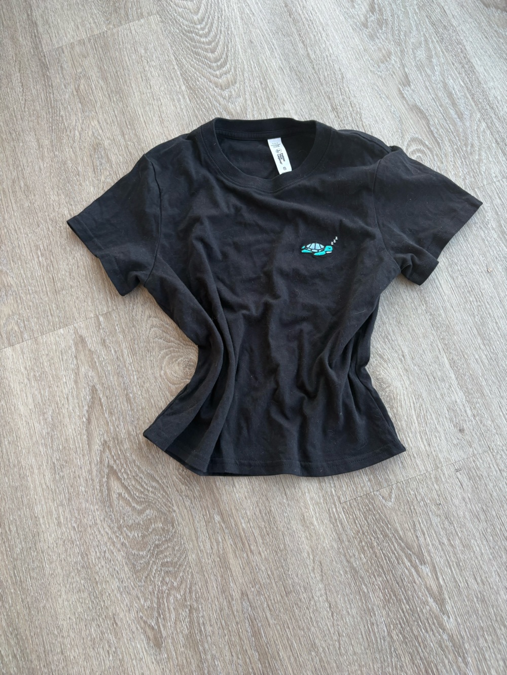 Women’s follow your lengend Black Tee with Teal Turtle Embroidery